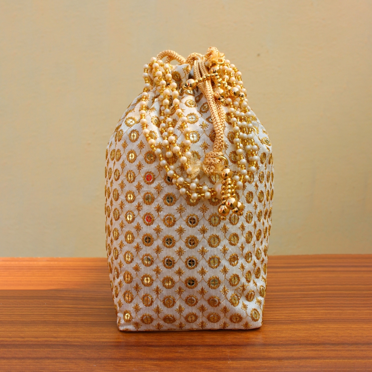 Designer Cream Golden Work Potali/Batwa - Buy Jain Designer Cream ...