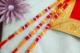 Picture of Orange Raksha Potli With Golden Dhaga