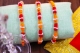 Picture of Orange Raksha Potli With Golden Dhaga