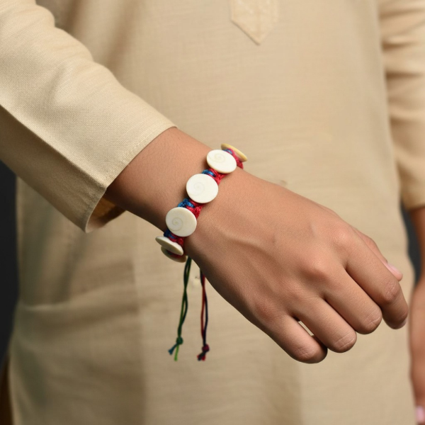 Picture of Multi Color Raksha Potli With Gomti Chakra